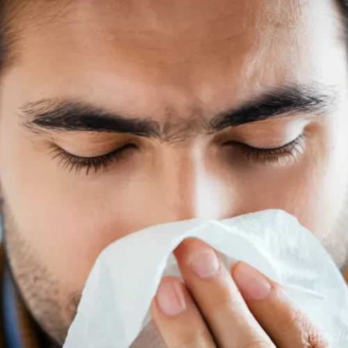 Home 27 비염 스프레이의 종류와 사용법 - **"A close-up shot of a diverse adult, appearing to be in their late 20s or early 30s, experiencing ...